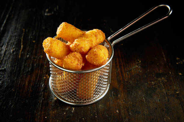 Fried tater tots in metal mesh