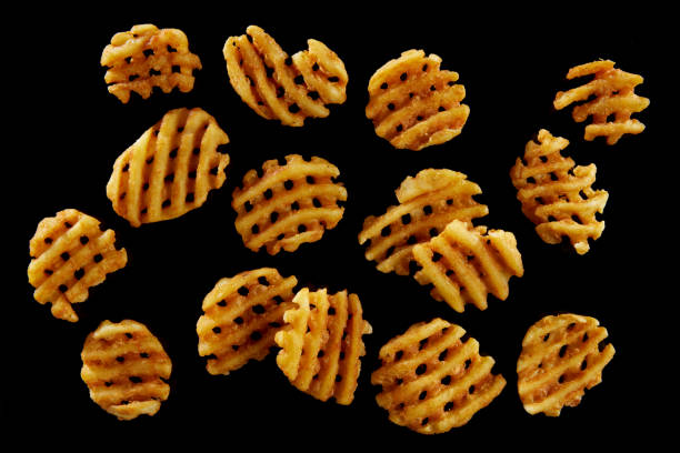 istock Delicious crispy potato grids arranged on black surface 1402859433