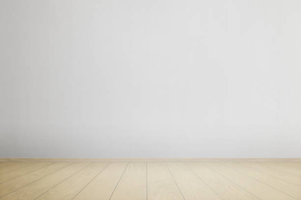 istock Empty room with white wall and wooden decking floor. Clean surface on floor and wall for product presentation 1402859584