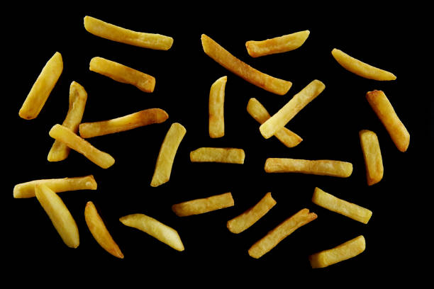 istock Abstract background of fried potatoes on black surface 1402859625