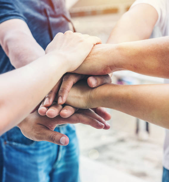 istock Together collaborate of hands teamwork outdoor 1402860562