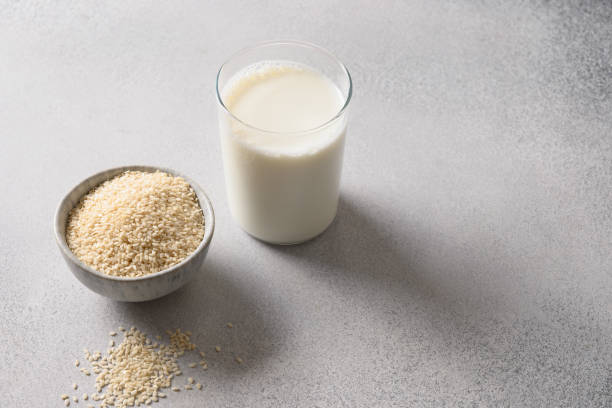 istock Vegan plant based sesame milk on gray background. 1402862429