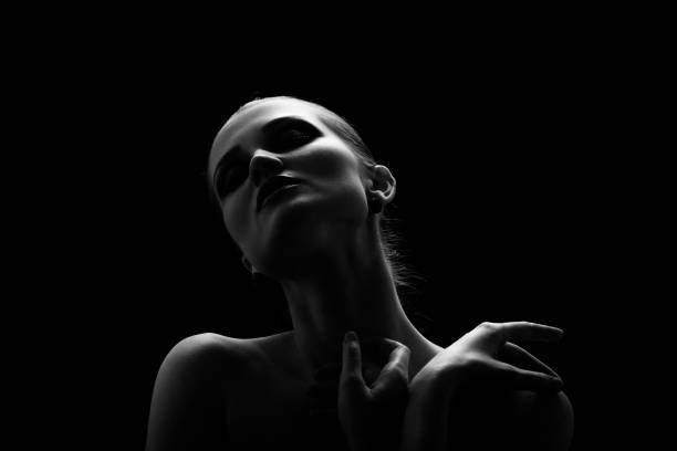 istock sensual woman in dark 1402869097