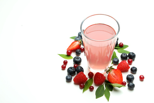 Delicious fresh berry mix and juice on white background