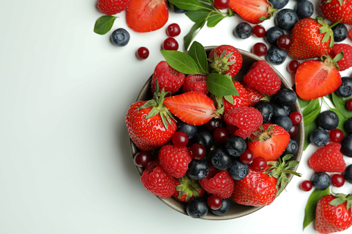 Delicious fresh berry mix on white background