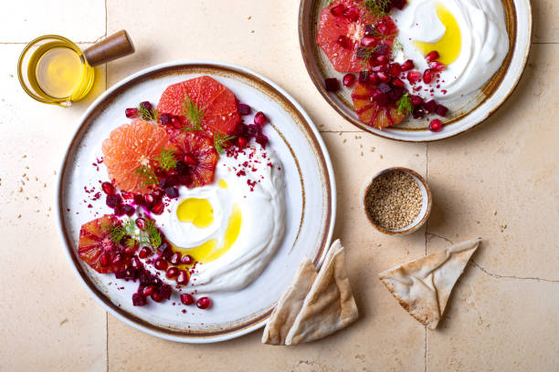 istock Labneh middle eastern lebanese cream cheese dip. Labneh with grapefruit,  roasted beetroot, pomegranate, fennel, sumac. 1402871709