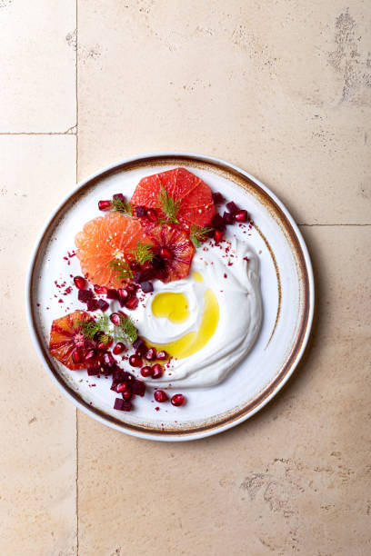 istock Labneh middle eastern lebanese cream cheese dip. Labneh with grapefruit,  roasted beetroot, pomegranate, fennel, sumac. 1402871722