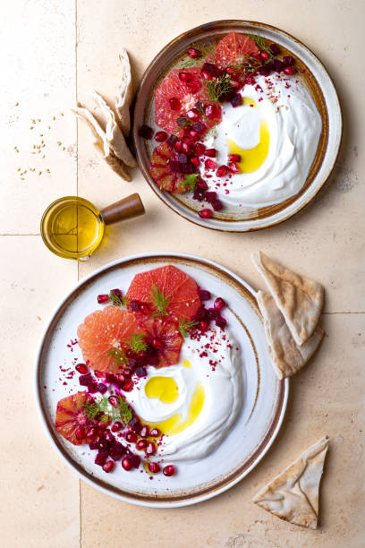 istock Labneh middle eastern lebanese cream cheese dip. Labneh with grapefruit,  roasted beetroot, pomegranate, fennel, sumac. 1402872397