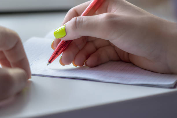 Close-up of female hands, sign paper document in the office