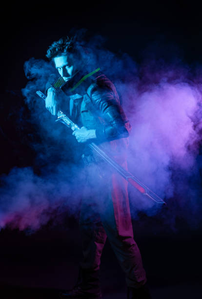 istock A guy in a cyberpunk image. Cyborg samurai is preparing to attack 1402873996