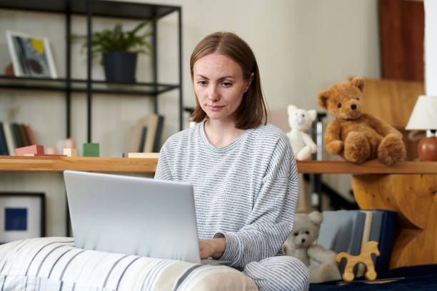 istock Young woman doing online work on laptop 1402876067