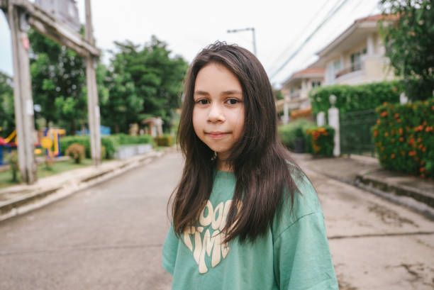 istock Serious pensive little girl looking at the camera 1402877348