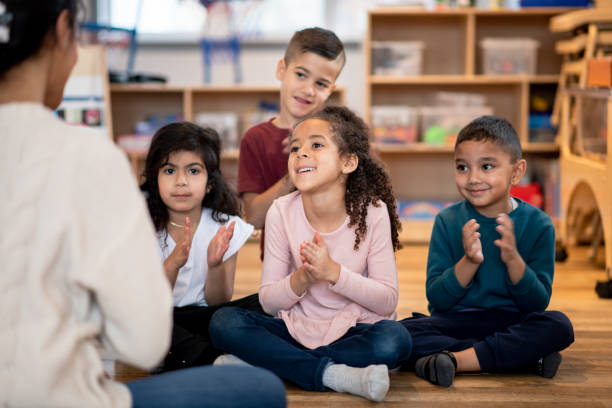 istock Daycare kids clap their hands 1402880590