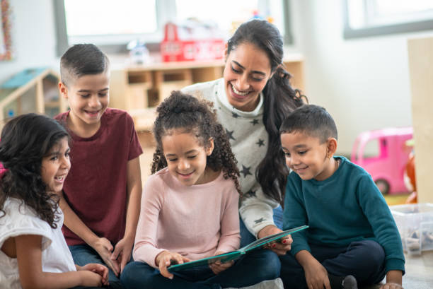 istock Daycare kids having fun reading together 1402880636