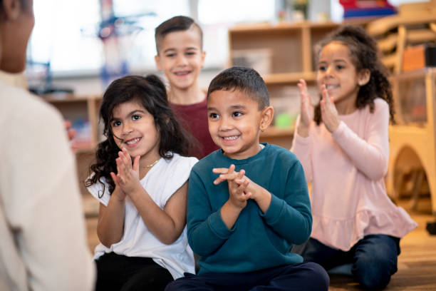 istock Daycare kids clap their hands 1402880645