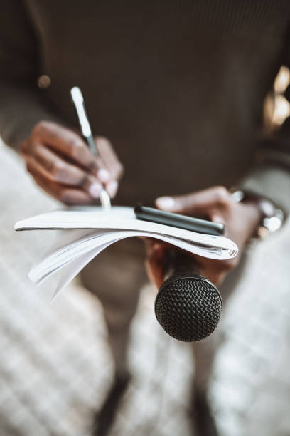 African Male Journalist Writing Questions For Press Conference
