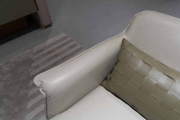 istock Close up of a corner of a light leather sofa 1402882098