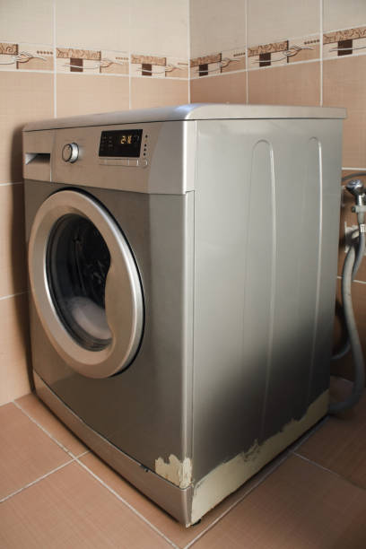 istock Washing machine in the bathroom 1402882173