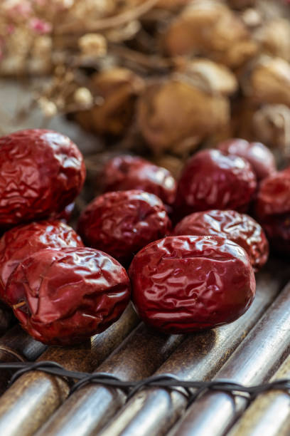 istock Dried red Jujube on the bamboo table 1402882428
