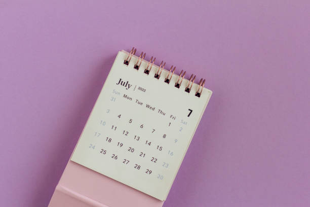 istock Desktop calendar for July 2022 on a lilac background., 1402887092