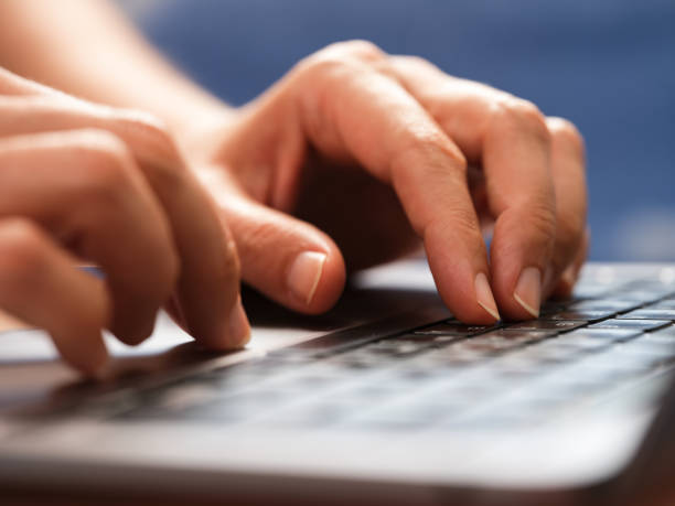 istock A woman typing on a laptop keyboard 1402887276