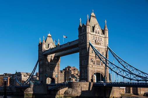 the historic drawbridge Tower Bridge over the River Thames in London on a sunny day