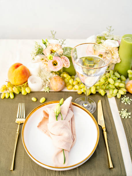 istock Festive colourful table setting. Restaurant, wedding, party decorated with flowers, candles, fruits and leaves. Midsummer or autumn mood event, romantic dinner. Florist decorator occupation. 1402890662