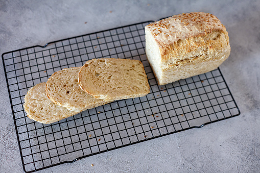 Sliced whole wheat bread on chopping board