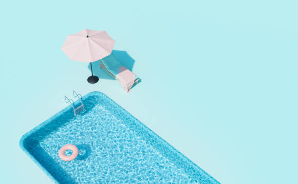 istock 3D lounger with parasol placed at poolside on sunny day 1402893670