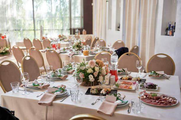 istock Table setting with sparkling wineglasses, plate with beige napkin and cutlery on table, copy space. Place set at wedding reception. Table served for wedding banquet in restaurant 1402895161