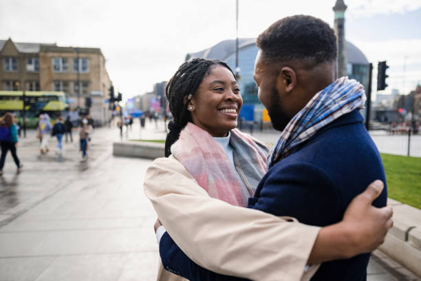 istock Cheerful Couple Embracing in City Centre 1402896114