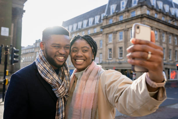 istock Couple Smiling and Taking Selfie With Mobile Phone 1402896227