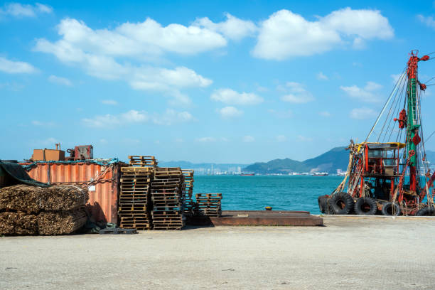 Small fishing boat on wooden pallets. Conceptual image about the fishing industry.