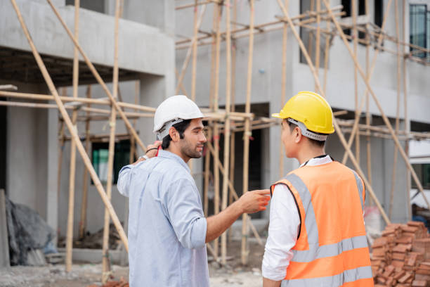 istock The engineer manager and foremen discussed and pointed to the site projects on the construction site to check the various functions. 1402896324
