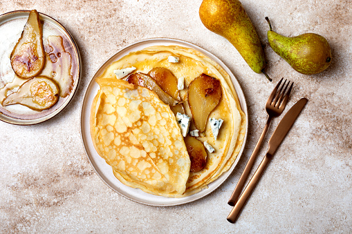 French Crepe with blue cheese and caramelized pears. Sweet and savoury homemade crepes pancakes recipe