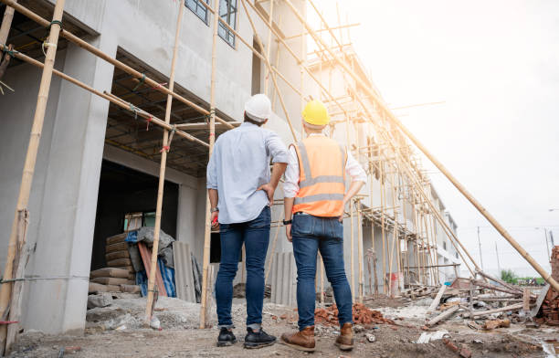 istock The engineer manager and foremen discussed and pointed to the site projects on the construction site to check the various functions. 1402896483