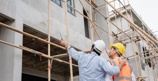 istock The engineer manager and foremen discussed and pointed to the site projects on the construction site to check the various functions. 1402896543