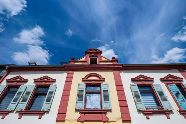 istock Impressive house facade in front of a white-blue sky 1402896711