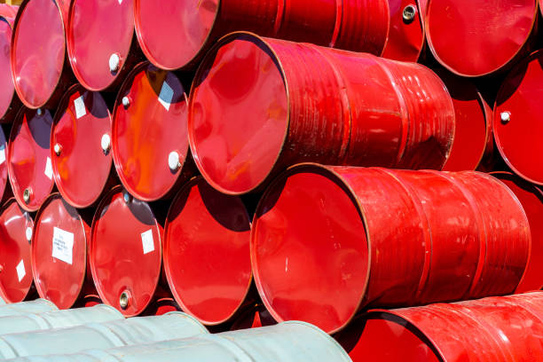 Metal barrels stacked in rows