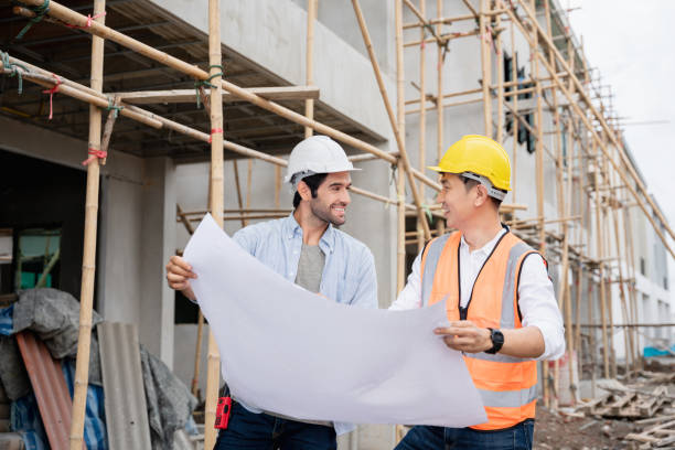 istock The engineer manager and foremen discussed the site projects on the construction site to check the various functions. 1402896749
