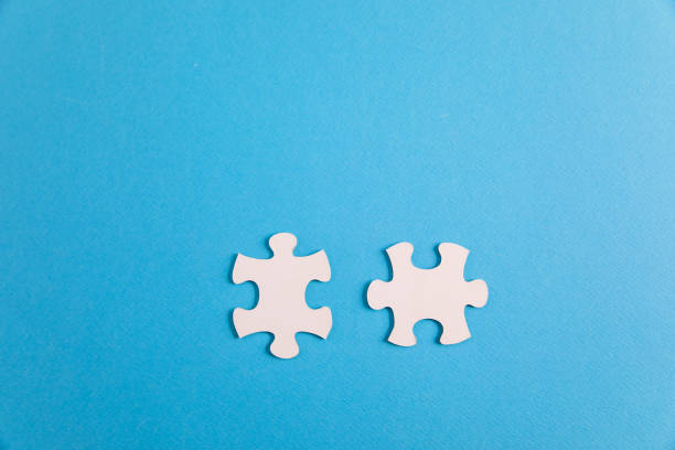 istock Two puzzle pieces. business strategy. 1402897853