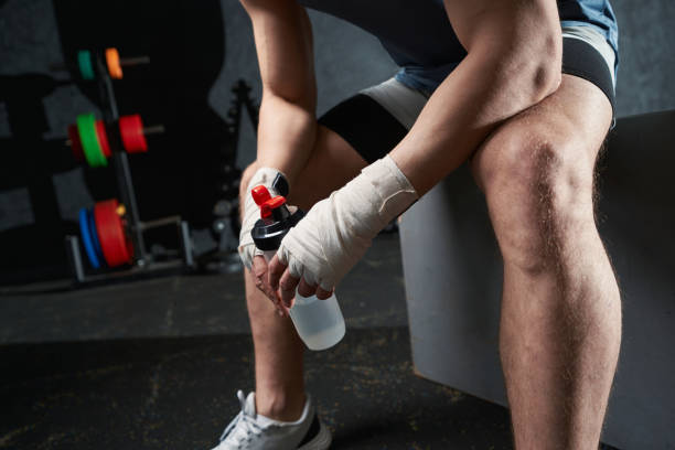 istock Sportsperson resting after plyometric workout at gym 1402899233