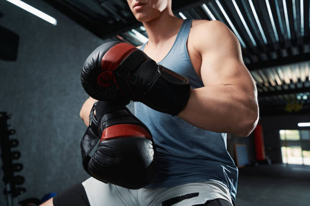 istock Professional boxer preparing for training session at gym 1402899418