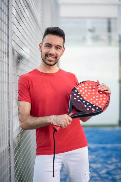Paddle tennis player in court posing for portrait stock photo