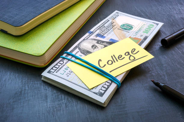Bundle of money with the inscription college. Tuition payment. stock photo