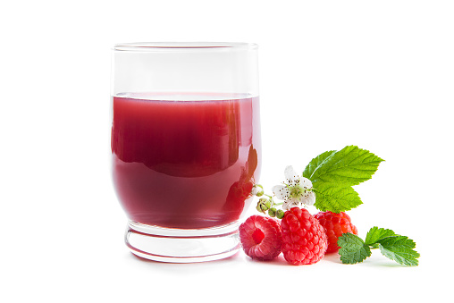 Fresh raspberries and juice isolated on white