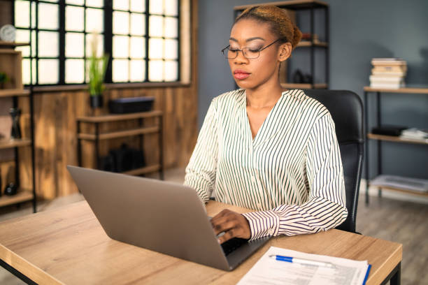 istock A secretary with her hands on a laptop keyboard typing 1402903052