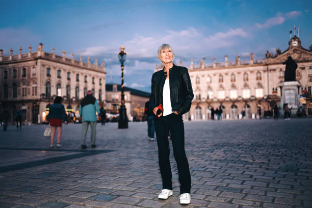 Female solo traveler at sunset at Place Stanislas in the town of Nancy in the Lorraine district of France.