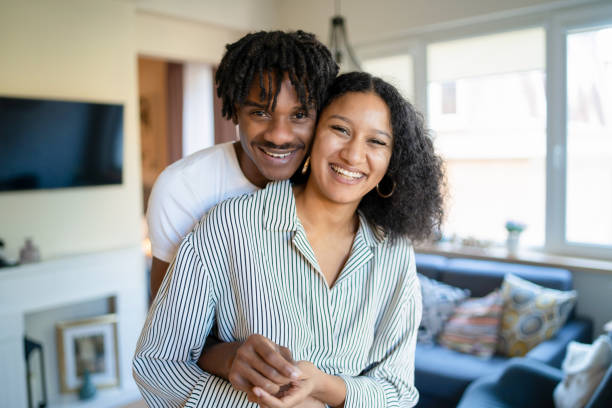 istock An embracing couple looking at the camera 1402904961