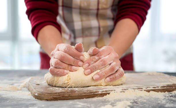 istock Woman kneading dough for homemade baking 1402905233